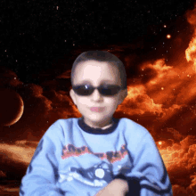 a boy wearing sunglasses and a shirt that says ' avengers ' on it