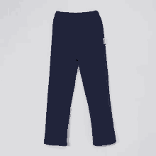 a pair of blue pants with a white sticker on the side that says ' a '