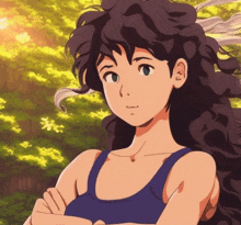 a girl with curly hair is wearing a blue tank top with her arms crossed