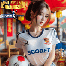 a woman holding a soccer ball in front of a museum bola sign