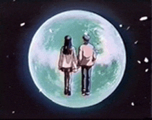 a man and a woman are standing in front of a full moon .