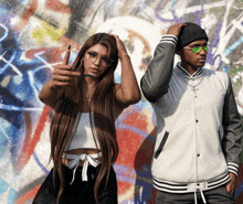 a man and woman standing in front of a graffiti wall