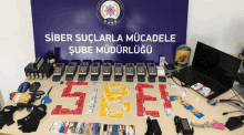 a table with a sign that says ' siber sucularla mucadele ' on it