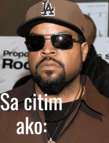 ice cube wearing a la hat and sunglasses says sa citim ako