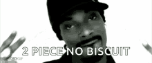 a black and white photo of snoop dogg with the words " 2 piece no biscuit " below him