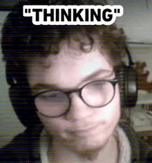 a man wearing glasses and headphones with the words " thinking " above his head