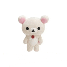 a white teddy bear with pink ears and a red button on its neck is standing on a white background .