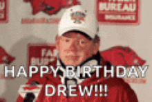 a man wearing a hat and a red jacket says happy birthday drew !!!