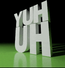 the word yuh is displayed on a green surface