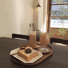 a tray of food including a slice of toast and a glass of milk