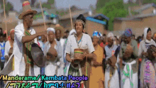 a group of people are gathered in a parade with the words manderame / kembata people on the bottom right