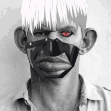 a black and white photo of a man with red eyes and a mask on his face