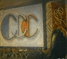 a painting of the letters cc on a white board