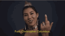 a woman giving the middle finger with the words fuck christopher columbus