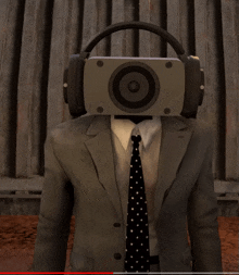 a man in a suit and tie with a speaker on his head