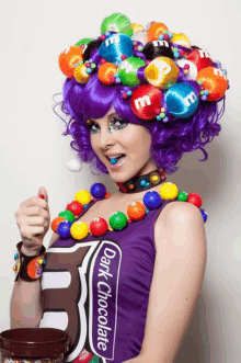 a woman is wearing a purple wig and a dark chocolate shirt