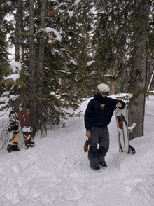 a snowboarder wearing a black sweatshirt that says ' sd ' on it