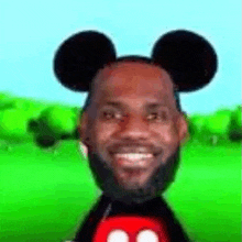 lebron james is wearing mickey mouse ears and smiling in a cartoon .