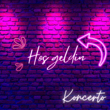 a neon sign on a brick wall that says hoş geldin