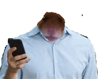 a man in a blue shirt is using a cell phone