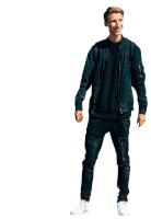 a young man wearing a black jacket and black jeans is standing in front of a white background