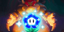 bowser is holding a blue flower in his hands in front of a glowing flower .