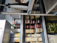 a fridge filled with a variety of food items including a bottle of new york cream cheese