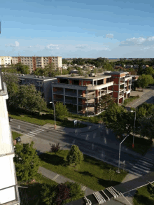 an aerial view of a residential area with lots of buildings and trees