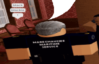 a man in a black shirt that says marechaussee maritime service on it