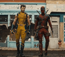 wolverine and deadpool are standing in front of a building that says liefeld 's