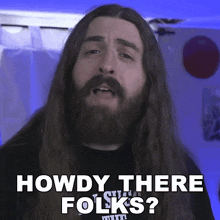 a man with long hair and a beard asks howdy there folks