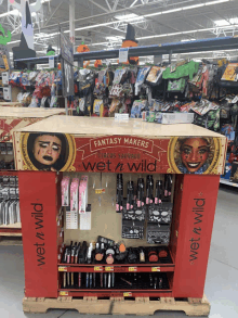 a wet n wild display in a store with makeup on it