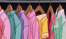 a bunch of colorful clothes are hanging on a rack .