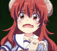 a girl with red hair and horns is crying and holding a stuffed animal