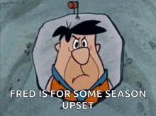 a cartoon of fred flintstone with the words fred is for some season upset below him