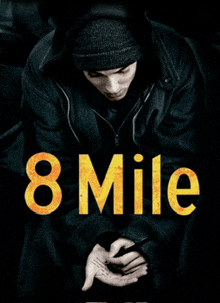 a poster for the movie 8 mile shows a man in a hooded jacket