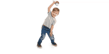 a young boy is playing with a poke ball