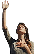 a woman is holding her hands up in the air and praying .