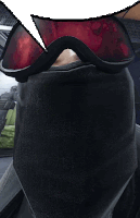 a person wearing a black scarf and red goggles