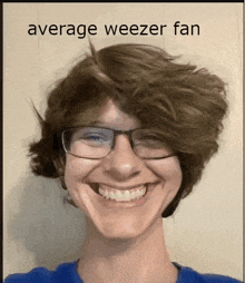 a young man wearing glasses is smiling with the words average weezer fan behind him