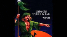 a man in a green robe is holding a spear and a flag .