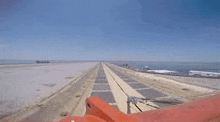 a view of a runway leading to the ocean from a boat .