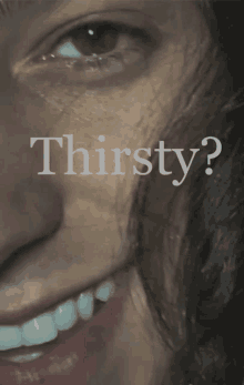 a close up of a woman 's face with the words thirsty written above her