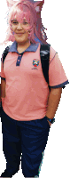 a person wearing a pink shirt with a skull on the front