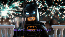 a lego batman holding a glass of water with the words have a happy new year