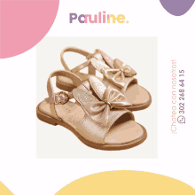 a pair of gold sandals with a bow and the word pauline