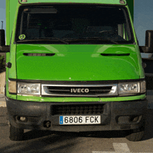 a green iveco van with a license plate that says 686 fck