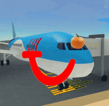 a blue and white airplane with a pumpkin in the cockpit