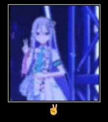 a blurry picture of a girl giving a peace sign .