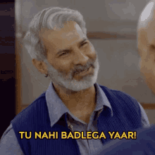 a man with a beard is talking to another man with the words tu nahi badlega yaar above him